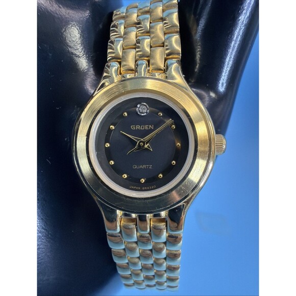 Vintage Gruen Quartz Ladies Gold Tone Black Dial Dainty Elegant Watch Runs Great